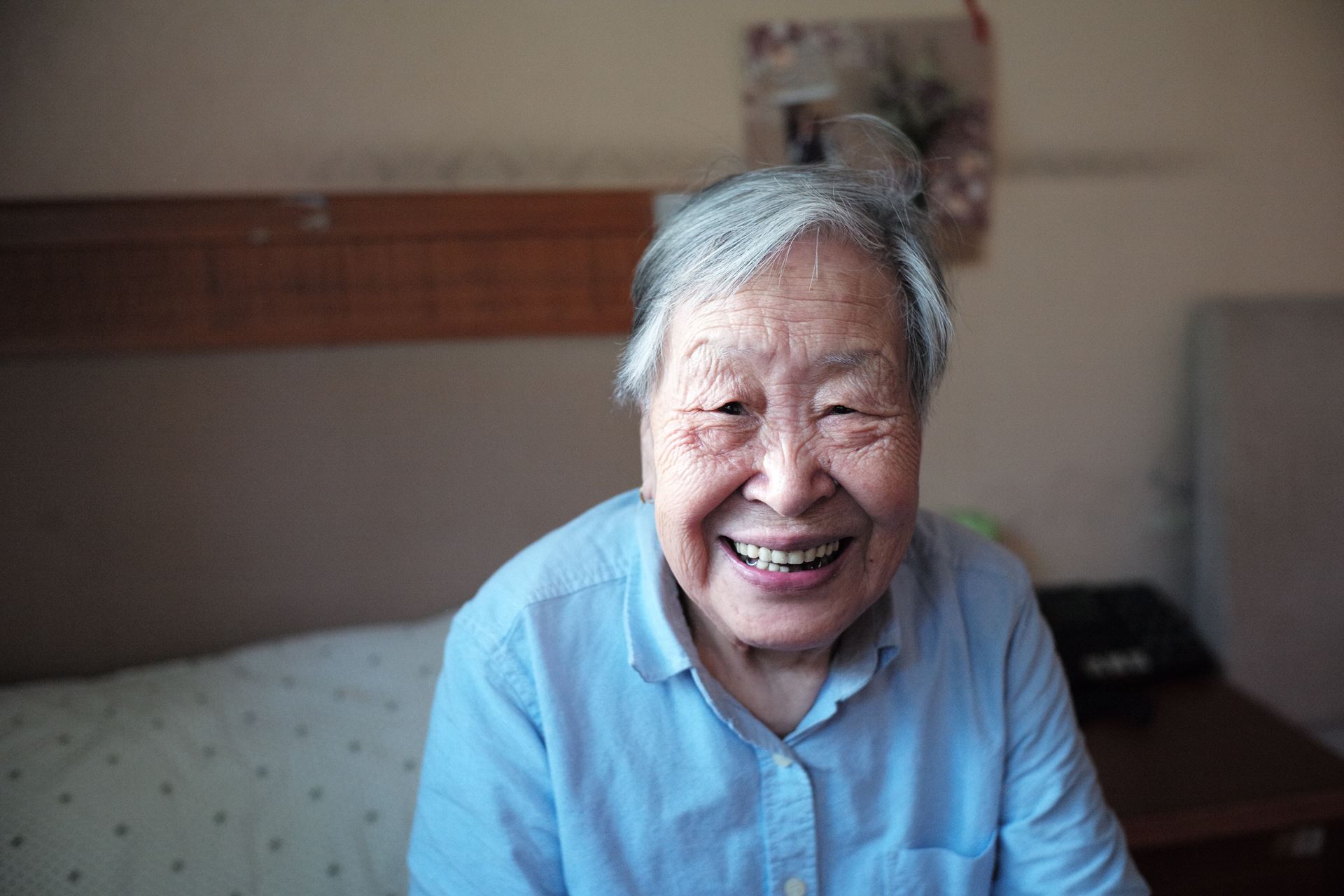 a elderly man smiling for the camera